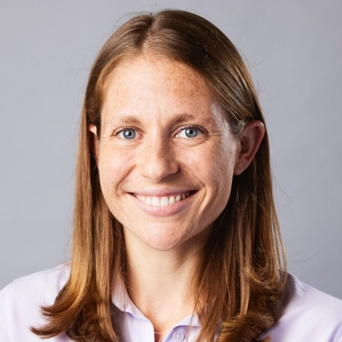 Headshot of Dani Alexander in a white collared shirt. 