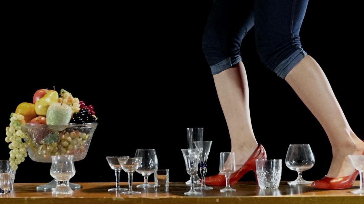 high heels walking among wine glasses