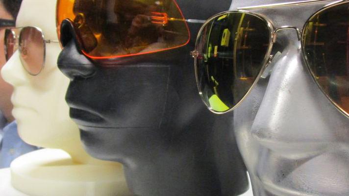 image of heads with coloured glasses