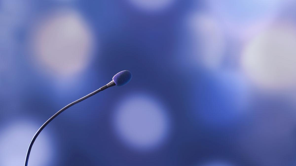 blue background, black microphone, photo, landscape