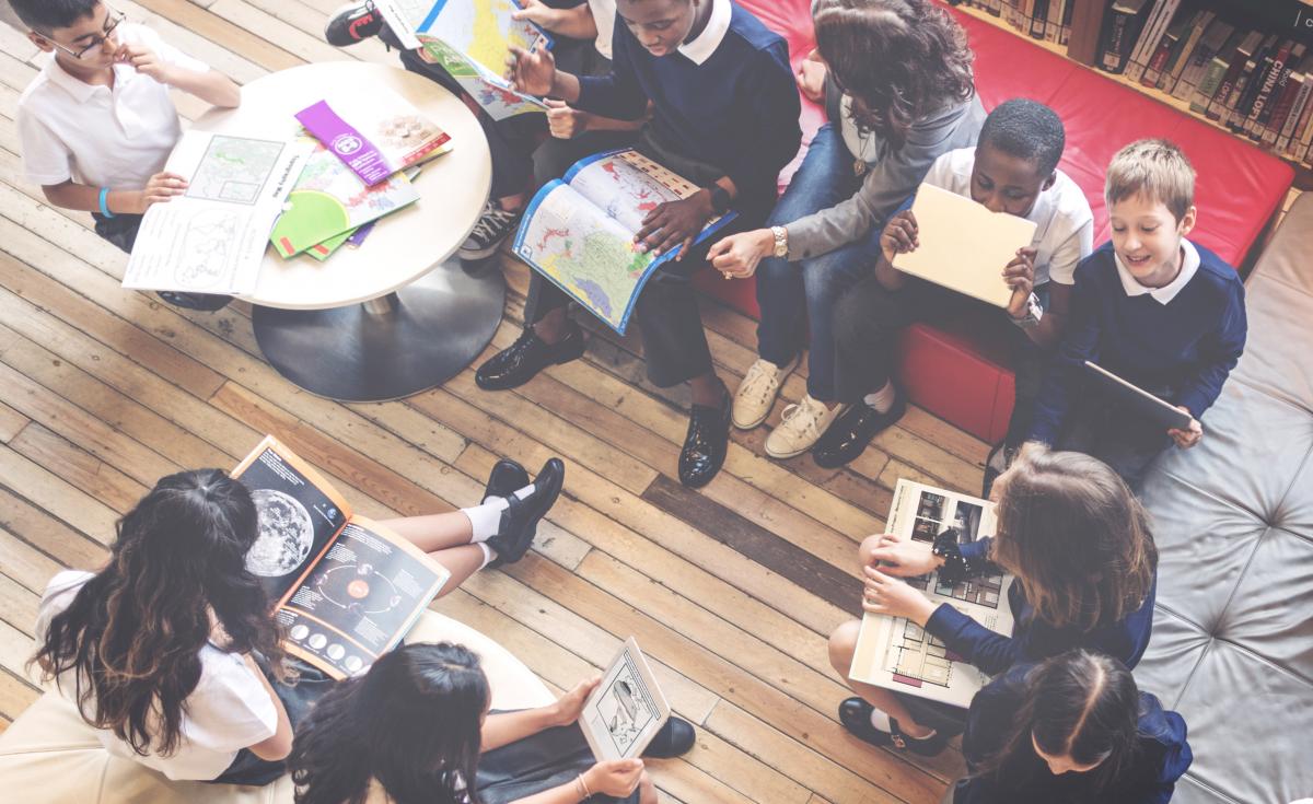 young students in a relaxed classroom, seen from above
