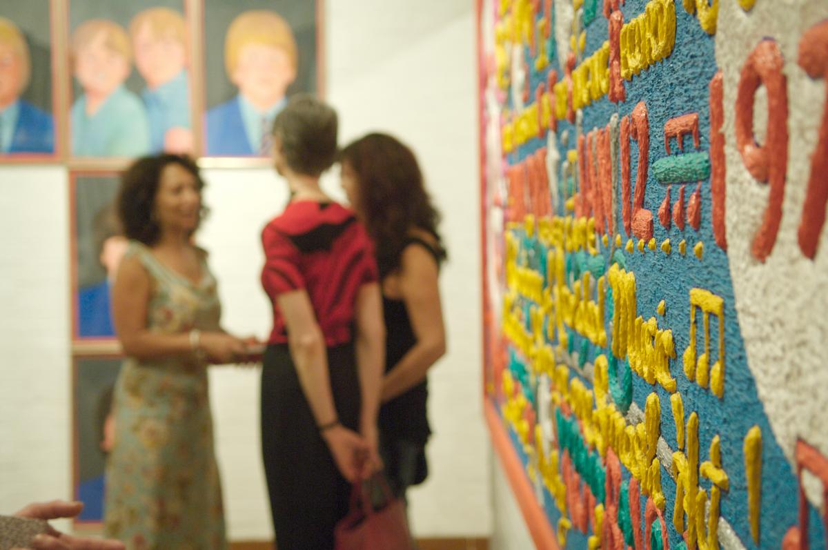 photo of people looking at art