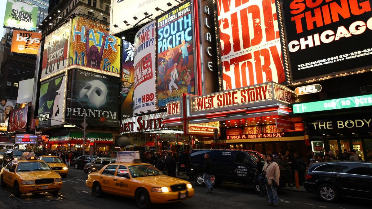photo of Broadway street with theatre signs