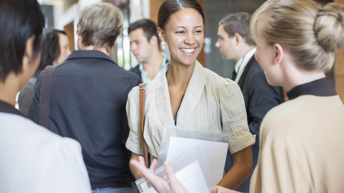 photo of young people talking in a crowd