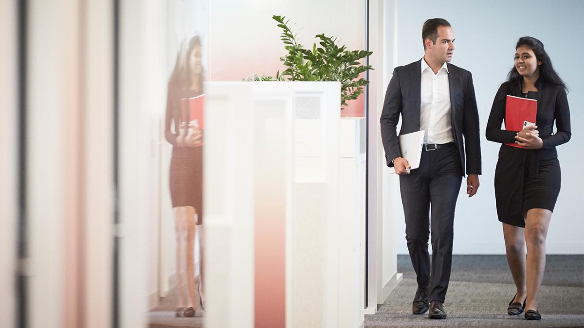 UNSW Business School PG Info Evening - photo of two people in business suits walking