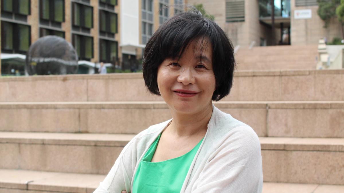 photo of a lady smiling, outside