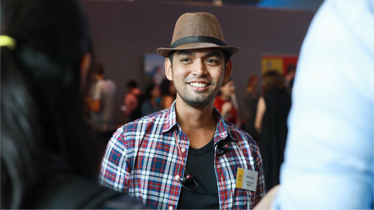 photo of  young man in a hat