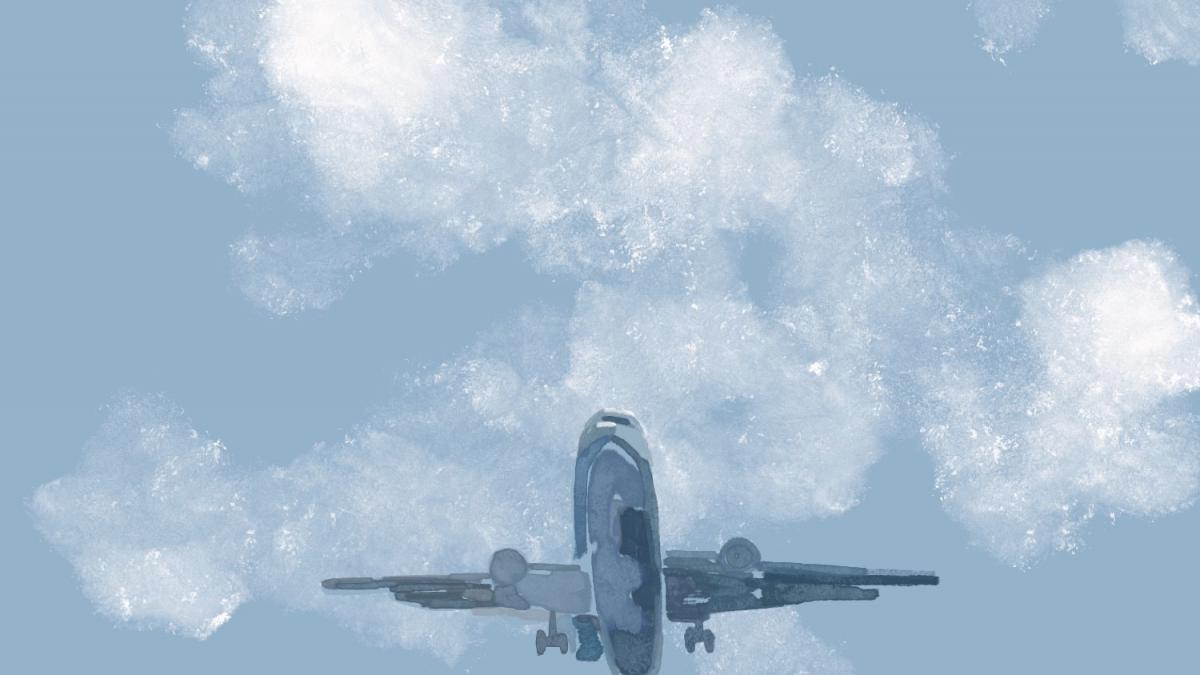 photo of a plane in the sky with clouds