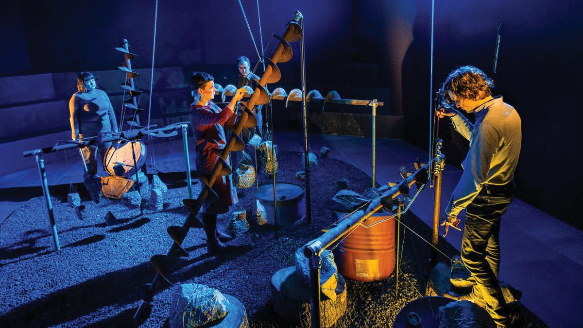 photo of musicians in a dark room