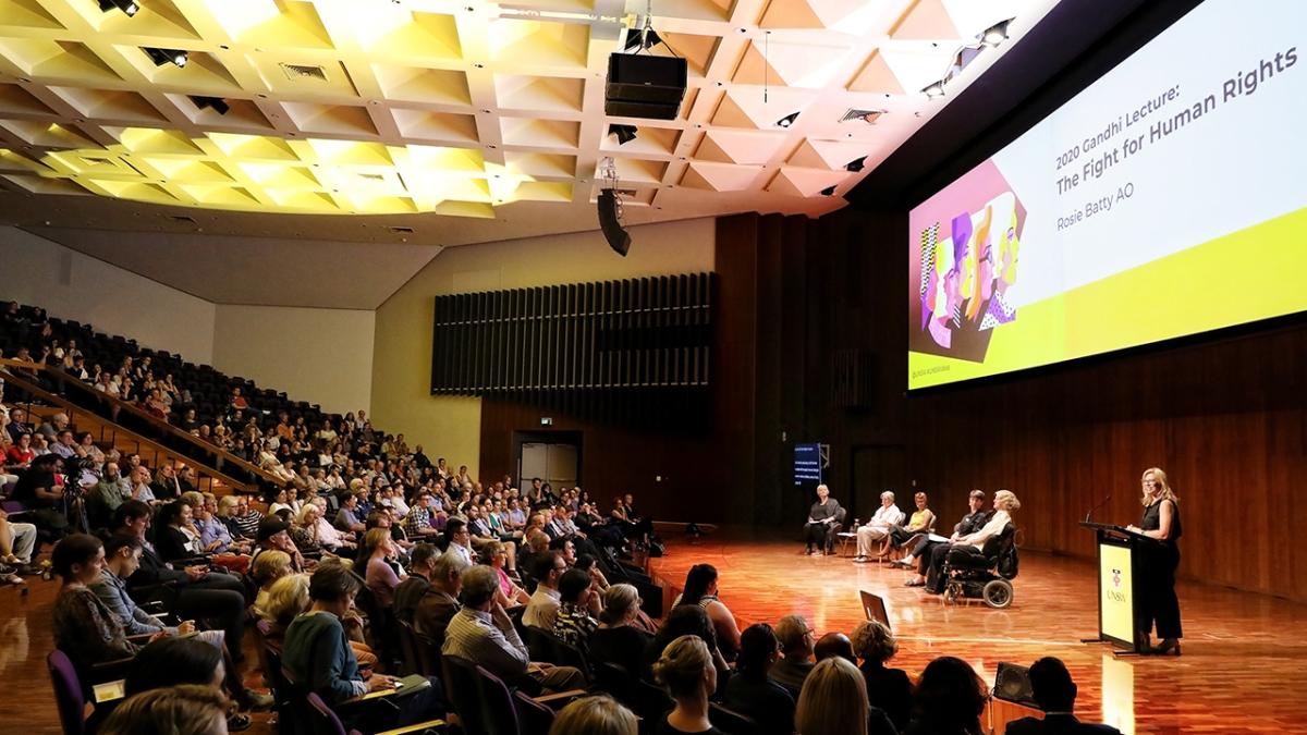 panel of speakers on stage